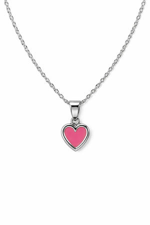 Silverhalsband med rosa hjärta i dagsljus